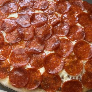 homemade pizza covered in pepperoni